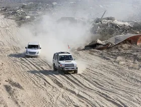 لحظة دخول الصليب الأحمر وكتائب القسام "الخط الأصفر" للبحث عن جثامين المحتجزين