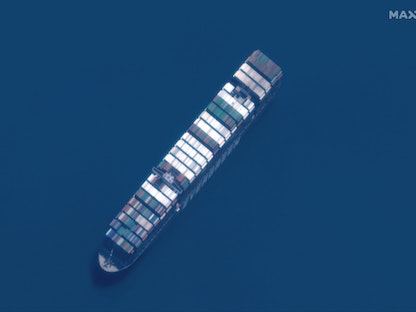 This satellite imagery released by Maxar Technologies shows a close up overview of the MV Ever Given container ship in the Great Bitter Lake area of the Suez Canal on April 12, 2021. - The MV Ever Given was refloated and the Suez Canal reopened on March 29, 2021, sparking relief almost a week after the huge container ship got stuck during a sandstorm and blocked a major artery for global trade. AFP correspondents observed tugboat crews sounding their foghorns in celebration after the Ever Given, a cargo megaship the length of four football fields, was dislodged from the banks of the Suez. (Photo by - / Satellite image �2021 Maxar Technologies / AFP) / RESTRICTED TO EDITORIAL USE - MANDATORY CREDIT "AFP PHOTO / Satellite image �2021 Maxar Technologies" - NO MARKETING - NO ADVERTISING CAMPAIGNS - DISTRIBUTED AS A SERVICE TO CLIENTS - AFP