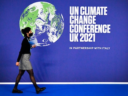 ملصق مؤتمر الأمم المتحدة لتغير المناخ COP26 في اليوم الأول من مؤتمر الأمم المتحدة لتغير المناخ COP26 في جلاسكو. اسكتلندا في 31 أكتوبر 2021 - AFP