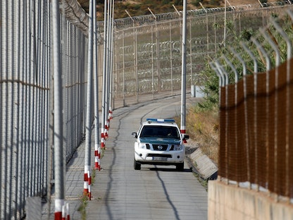 السياج الحدودي في جنوب سبتة الفاصلة بين إسبانيا والمغرب - 22 يونيو  2018. - REUTERS