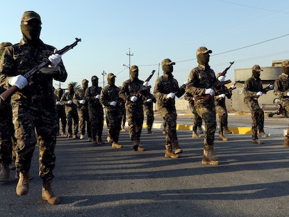 عناصر من "الحشد الشعبي" العراقي يشاركون بعرض عسكري في كركوك - REUTERS