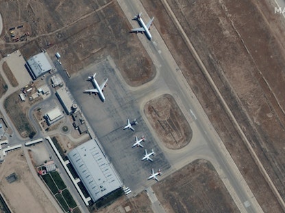 Six commercial airplanes are seen near the main terminal of the Mazar-i-Sharif airport - REUTERS via Maxar Technologies