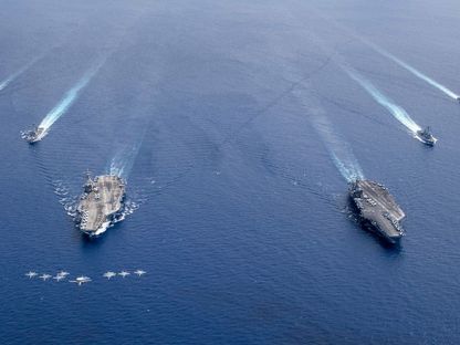 حاملات طائرات أميركية في المحيط الهادئ الهندي تسير في حماية مقاتلات أميركية، 7 يوليو 2020 - AFP