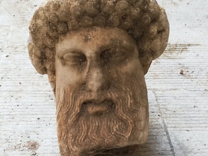 رأس التمثال اليوناني هيرميس  - AFP