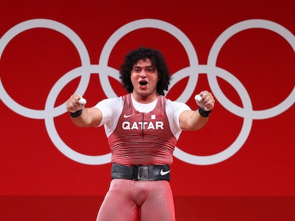 فرحة الرباع القطري فارس إبراهيم حسونة بعد الفوز بالميدالية الذهبية - REUTERS
