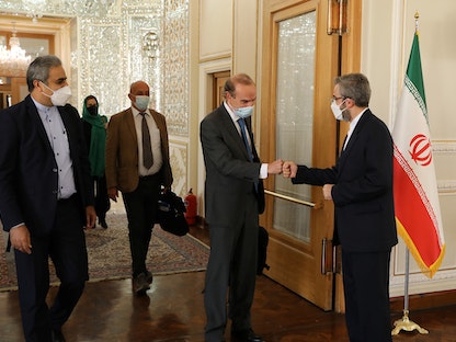 كبير المفاوضين الإيرانيين علي باقري، يلتقي مع كبير المفاوضين الأوروبيين إنريكي مورا في طهران - 14 أكتوبر 2021 - via REUTERS