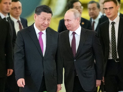 الرئيس الصيني شي جين بينج يلتقي الرئيس الروسي فلاديمير بوتين في موسكو - 05 يونيو 2019 - REUTERS