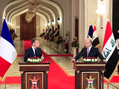 الرئيس العراقي برهم صالح خلال مؤتمر صحافي مشترك مع نظيره الفرنسي إيمانويل ماكرون، بغداد، 20 أغسطس 2021 - REUTERS