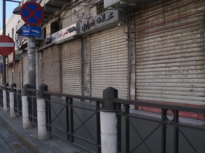 شوارع خالية ومحال مغلقة بعد قرارات حظر التجوال، عمان، الأردن - الشرق