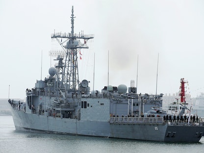 فرقاطة الصواريخ الأسترالية الموجهة HMAS Melbourne (III) تصل إلى ميناء تشينج داو احتفالاً بالذكرى الـ70 لتأسيس جيش التحرير الصيني. تشينج داو، الصين. 21 أبريل 2019 - REUTERS