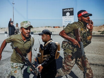 عناصر من قوات الحشد الشعبي العراقي الموالي لإيران في العاصمة العراقية بغداد، 2 يوليو 2019 - REUTERS