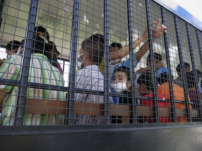 مجموعة من أقلية الأويغور في مركز احتجاز ببلدة سونغكلا جنوب تايلاند- 14 أبريل 2014 - REUTERS