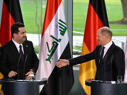 المستشار الألماني أولاف شولتز خلال مؤتمر صحافي مع رئيس الوزراء العراقي محمد شياع السوداني في برلين، 13 يناير 2023  - AFP