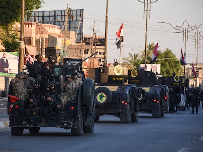 عناصر من قوات الأمن العراقية في شوارع تكريت شمالي بغداد - 10 أكتوبر 2021 - AFP