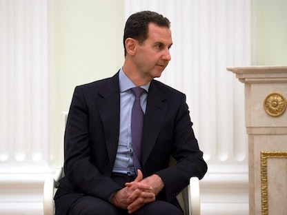 الرئيس السوري بشار الأسد يحضر اجتماعاً مع نظيره الروسي فلاديمير بوتين في الكرملين. 15 مارس 2023 - REUTERS