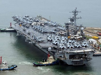 حاملة الطائرات USS Theodore Roosevelt في ميناء بوسان بكوريا الجنوبية. 22 يونيو 2024 - AFP