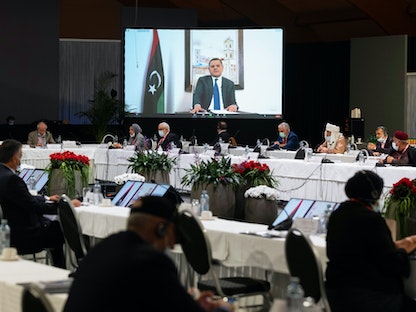 رئيس الحكومة الليبية المؤقتة الجديدة عبد الحميد الدبيبة أثناء مخاطبته فعاليات الحوار الليبي بجنيف- 3 فبراير 2021 - AFP
