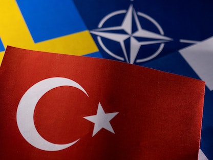 أعلام "الناتو" وتركيا والسويد وفنلندا- 18 مايو 2022 - REUTERS