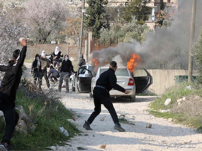 اشتباكات بين فلسطينيين ومستوطنين في الضفة الغربية المحتلة. 25 فبراير 2023 - AFP