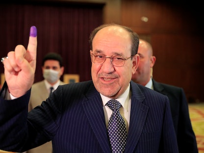 رئيس الوزراء العراقي الأسبق نوري المالكي بعد الإدلاء بصوته في الانتخابات البرلمانية بمركز اقتراع في بغداد- 10 أكتوبر 2021 - REUTERS