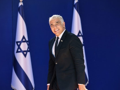 وزير الخارجية الإسرائيلي الجديد يائير لبيد في مقر إقامة الرئيس الإسرائيلي بالقدس- 14 يونيو 2021. - AFP