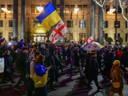 مظاهرات داعمة لأوكرانيا بمناسبة الذكرى الأولى للحرب في العاصمة الجورجية تبليسي. 24 فبراير 2023 - REUTERS