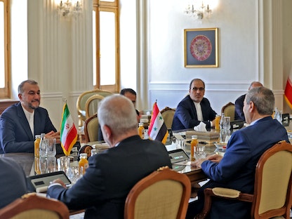 وزير الخارجية الإيراني حسين أمير عبد اللهيان يلتقي بنظيره السوري فيصل المقداد في العاصمة طهران. 20 يوليو 2022 - AFP