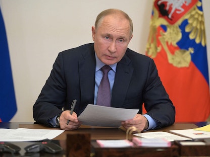 الرئيس الروسي فلاديمير بوتين يترأس اجتماعاً يضم أعضاء الحكومة وقيادة حزب روسيا الموحدة عبر الفيديو كونفرانس - 14 سبتمبر 2021. - AFP