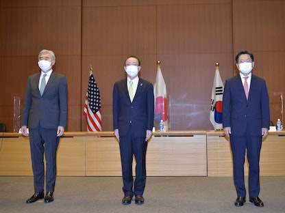 المشاركون في الاجتماع الثلاثي بطوكيو - 14 سبتمبر 2021 - REUTERS