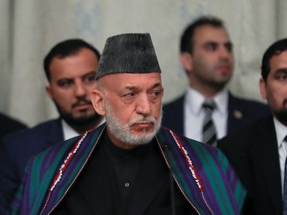 حامد كرزاي رفقة مسؤولين أفغان يحضرون محادثات السلام مع وفد من حركة طالبان في موسكو- 2015 - REUTERS