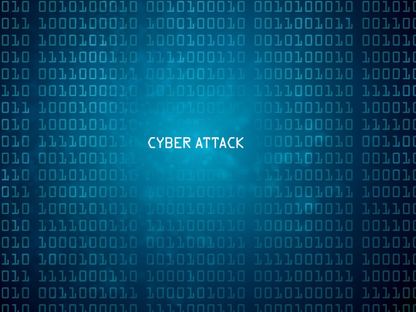 صورة تعبيرية للغة الآلة تظهر أمامها كلمة هجمات إلكترونية - Getty Images