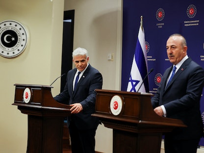 وزير الخارجية التركي مولود جاويش أوغلو يلتقي نظيره الإسرائيلي يائير لبيد في أنقرة - 23 يونيو 2022 - REUTERS