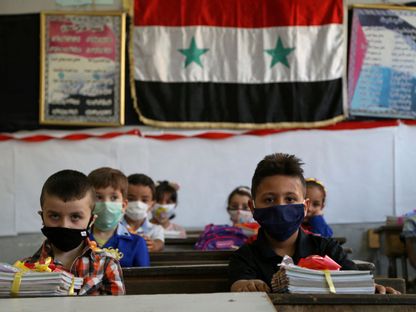 طلاب في فصل دراسي في دمشق، مع بدء الموسم الدراسي، 13 سبتمبر - REUTERS