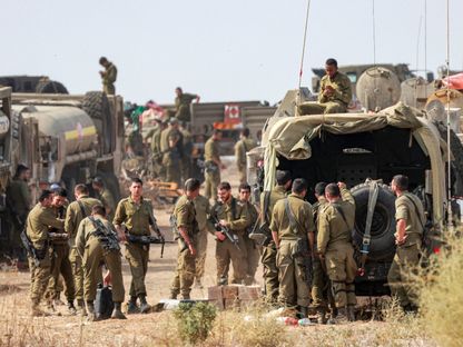 قوات إسرائيلية تحتشد بالقرب من قطاع غزة. 11 أكتوبر 2023 - Reuters