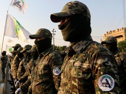 صورة أرشيفية لعناصر من الحشد الشعبي خلال في عرض عسكري في كركوك. العراق. 28 يونيو 2019 - Reuters