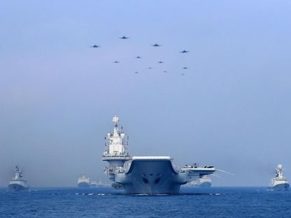 سفن حربية وطائرات مقاتلة صينية تشارك في تدريب في بحر الصين الجنوبي - 12 أبريل 2018 - REUTERS
