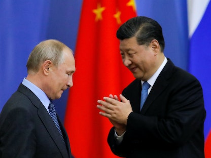 الرئيسان الصيني شي جين بينج والروسي فلاديمير بوتين خلال منتدى في سان بطرسبرج - 6 يونيو 2019 - REUTERS