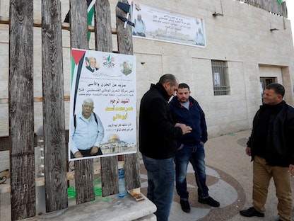 ملصق للفلسطيني عمر عبد المجيد أسعد (80 عاما) وجد ميتاً ومقيداً في قرية جلجيلية بالضفة الغربية المحتلة - 12 يناير 2022 - REUTERS