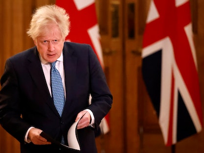 رئيس الوزراء البريطاني بوريس جونسون خلال مؤتمر صحافي افتراضي في لندن - REUTERS