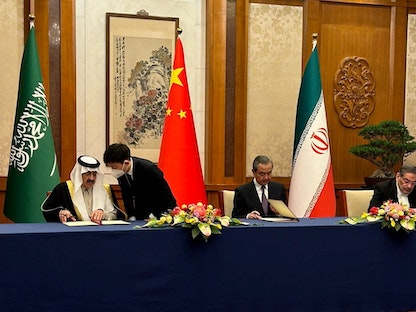 ممثلو السعودية وإيران والصين خلال توقيع الاتفاق. 10 مارس 2023 - REUTERS