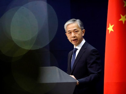 المتحدث باسم وزارة الخارجية الصينية وانج وين بين خلال مؤتمر في بكين، الصين في 14 ديسمبر 2020.  - REUTERS