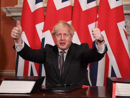 رئيس الوزراء البريطاني بوريس جونسون عقب توقيع اتفاقية التعاون التجاري مع الاتحاد الأوروبي بالعاصمة لندن - 30 ديسمبر 2020 - AFP