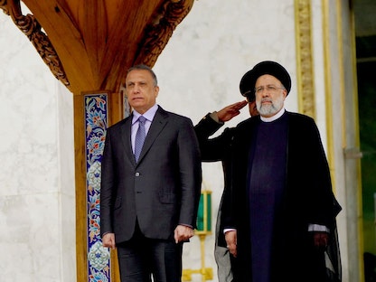 الرئيس الإيراني إبراهيم رئيسي يستقبل رئيس الوزراء العراقي مصطفى الكاظمي في العاصمة طهران - 26 يونيو 2022 - REUTERS