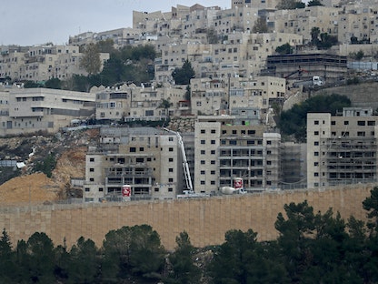 جانب من المستوطنات الإٍسرائيلية قيد البناء في الجزء الشرقي من مدينة القدس 5 يناير 2022 - AFP