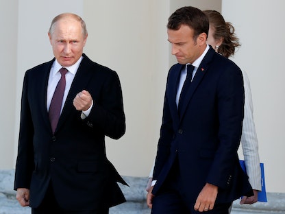 الرئيسان الروسي فلاديمير بوتين والفرنسي إيمانويل ماكرون في سانت بطرسبرج في روسيا. 24 مايو 2018 - REUTERS
