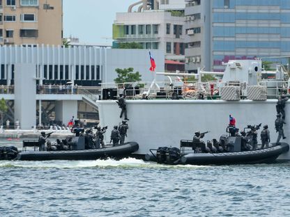 القوات الخاصة التايوانية تشارك في تدريبات خفر السواحل في مدينة "كاوهسيونج" جنوب تايوان. 10 يونيو 2023 - AFP