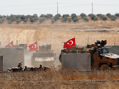 القوات التركية والقوات الأميركية خلال دورية مشتركة شمال سوريا- 8 سبتمبر 2019 - REUTERS
