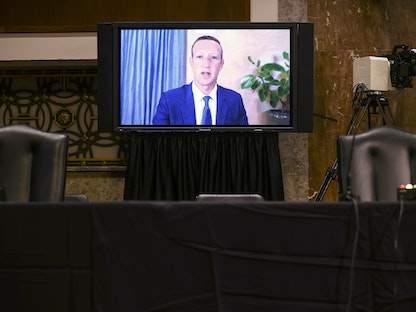مارك زوكربرغ خلال جلسة استماع عن بعد بالكونغرس الأمريكي - AFP