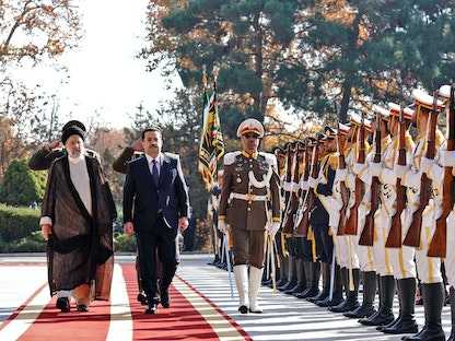 الرئيس الإيراني إبراهيم رئيسي يستقبل رئيس الوزراء العراقي محمد شياع السوداني في القصر الرئاسي، طهران - 29 نوفمبر 2022  - AFP