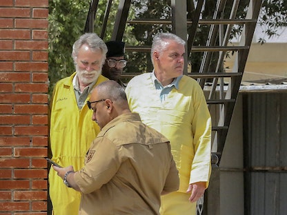 الألماني فولكال وولدمان والبريطاني جيمس فيتون في محكمة في بغداد  - AFP